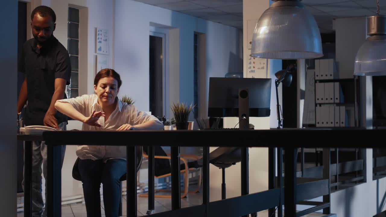 Diverse people leaving small business office at night