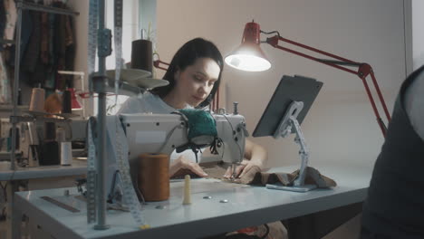 woman sewing on a sewing machine