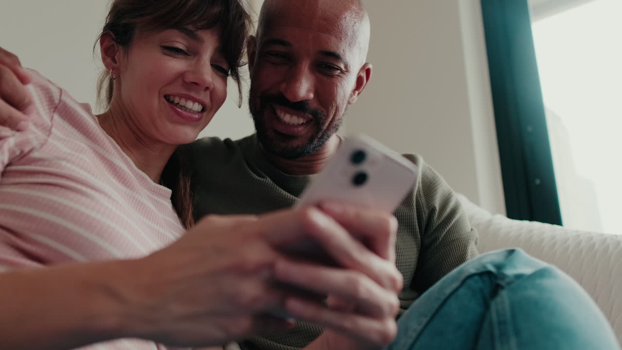 Happy Couple Browsing Internet on Phone