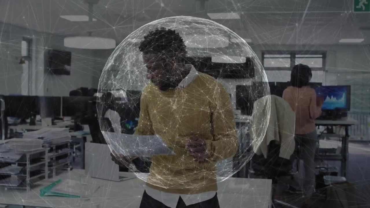 Man examining documents in business office, featuring spherical network overlay data visualization