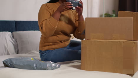 woman unpacking online order at home