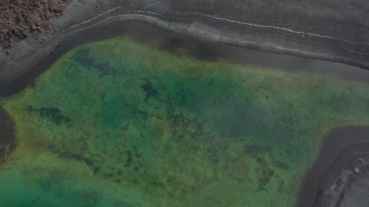 Aerial drone view of mountain sea and volcanoes in Lanzarote, Canary Islands, Spain