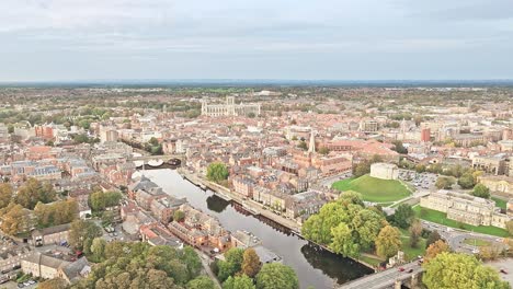 reflection of historical buildings in the calm river in york on a sunny day