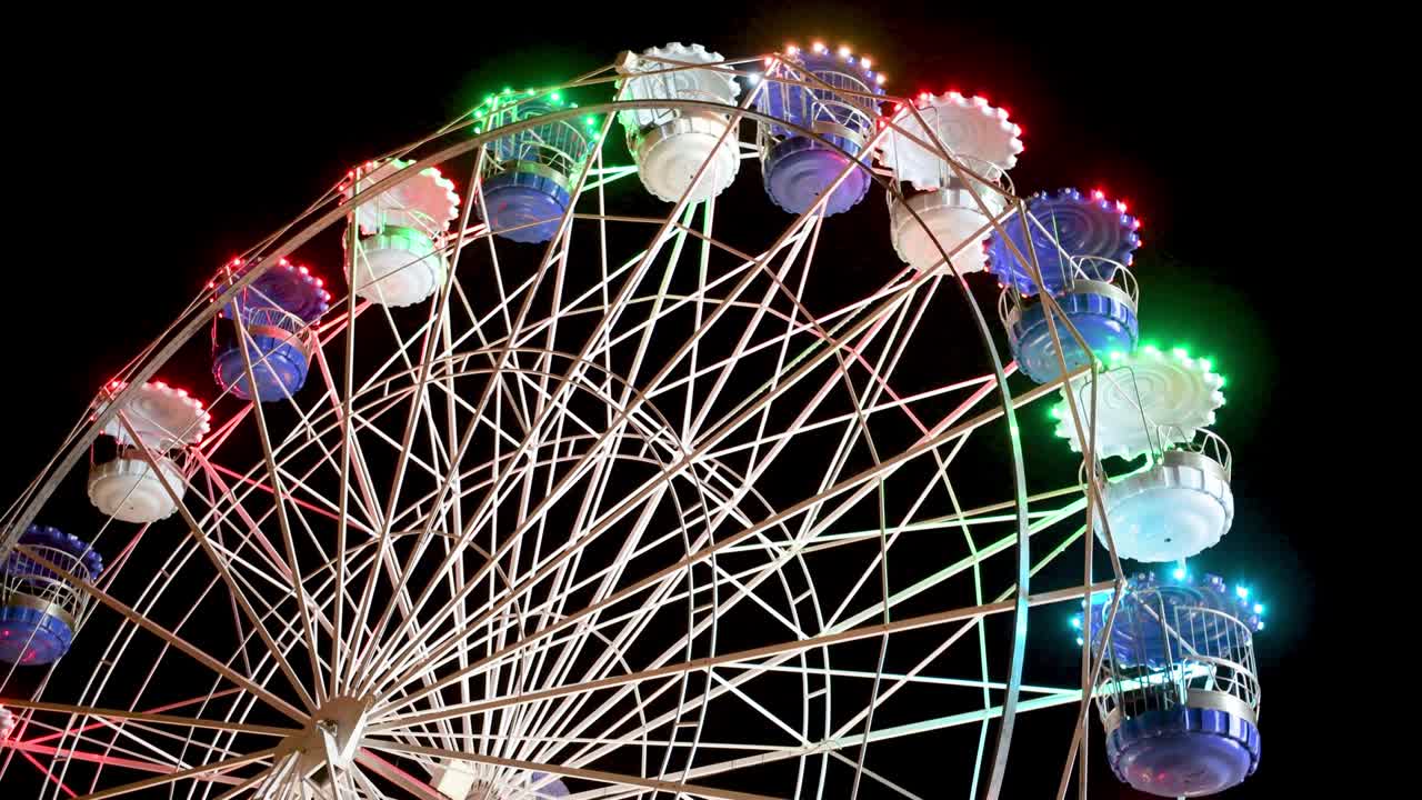 Spinning ferris wheel in motion