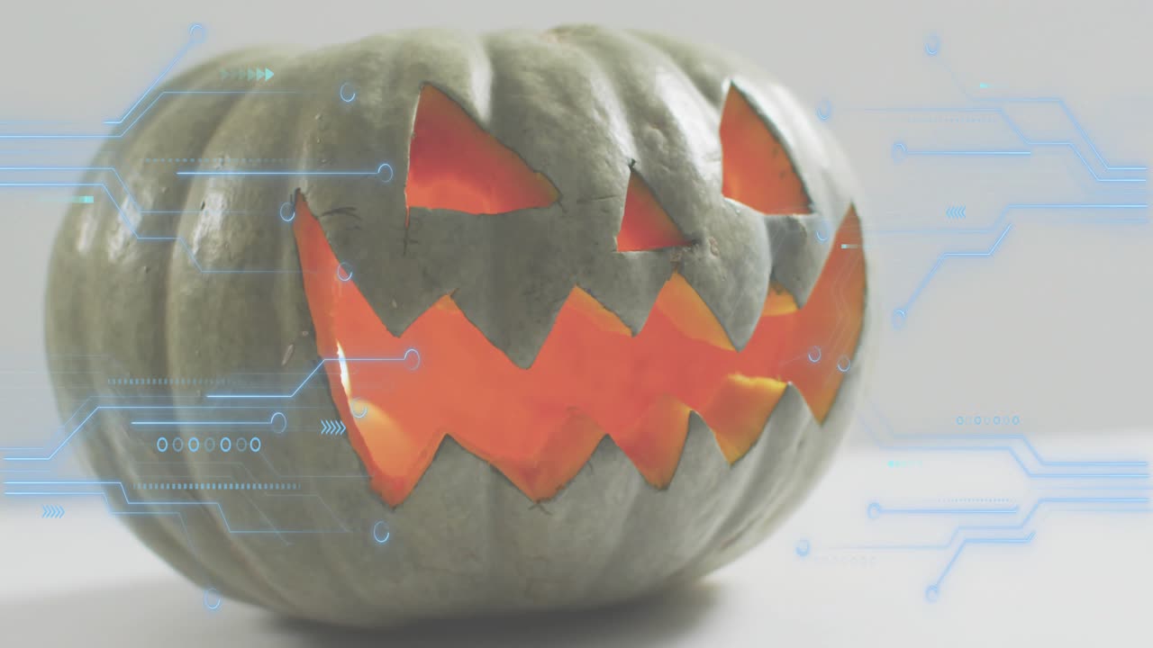 On start jack-o'-lantern glowing getting blue circuits fading pulsing around sides for tech theme
