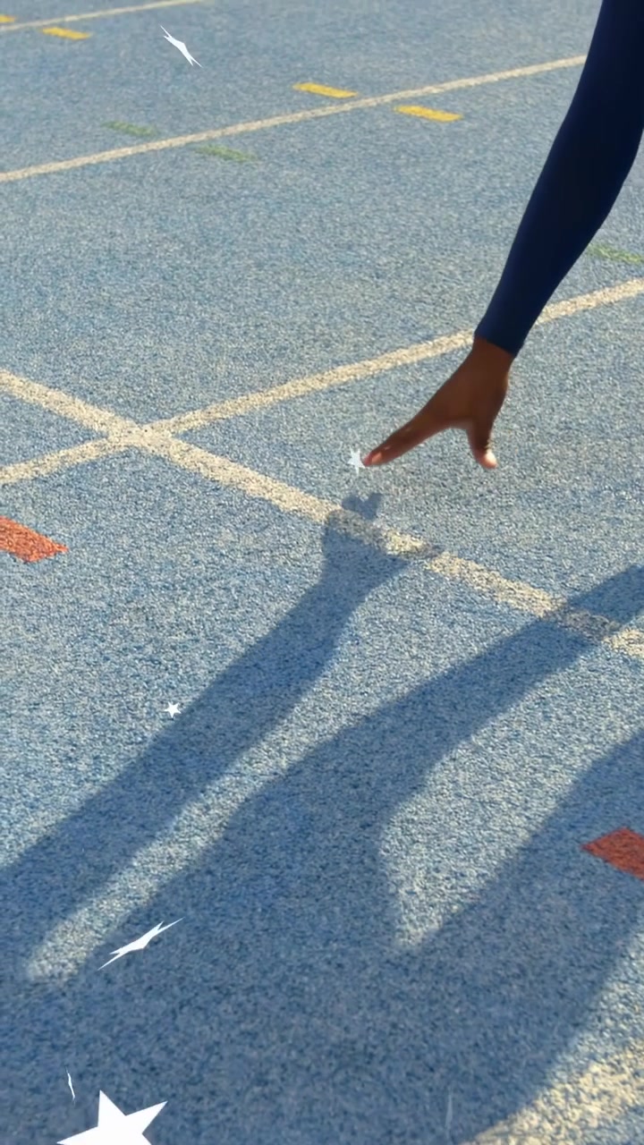 Vertical video: Runner entering, planting hands on track, crouching for sprint as stars overlay