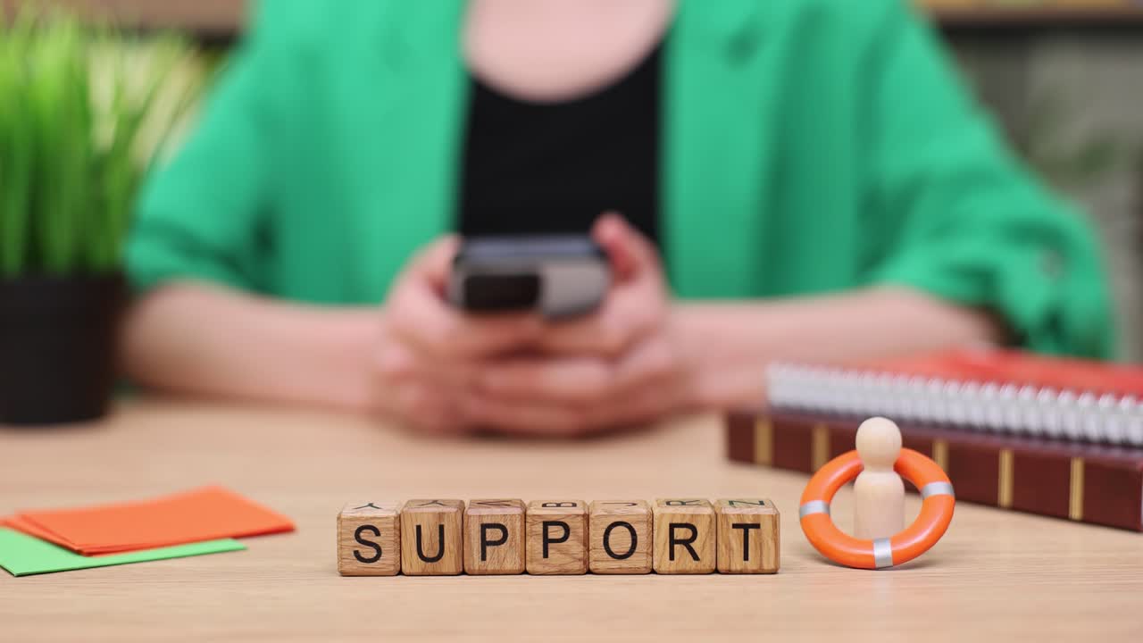 Support Concept with Wooden Cubes and Lifebuoy
