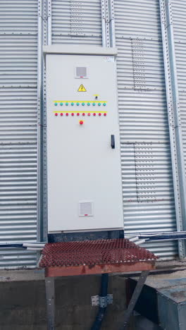 grain storage generator. grain storage generator with big metal tank. vertical video