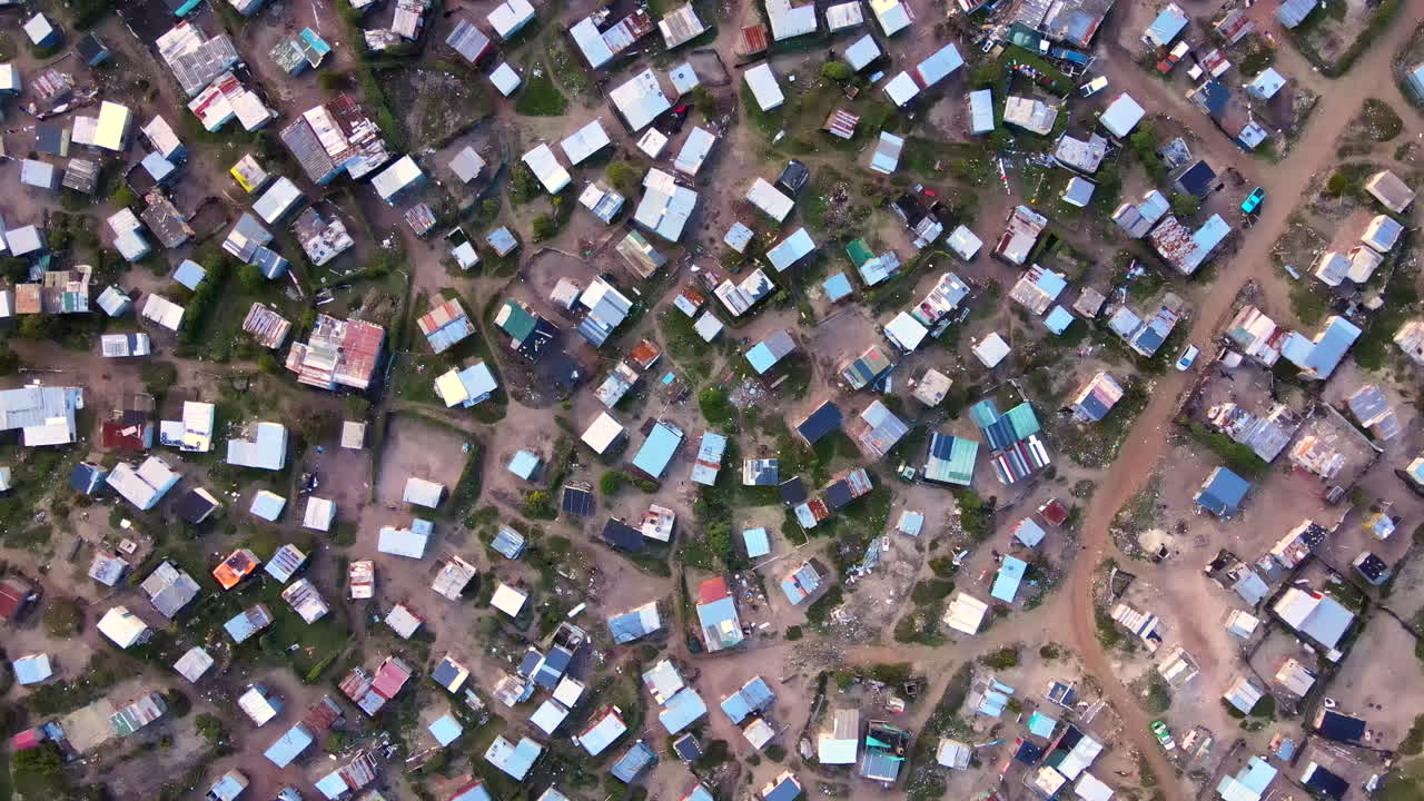 Township with makeshift shacks of low-income community in South Africa, aerial