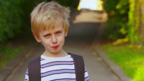 Portrait-of-a-cute-little-boy-who-doesn't-want-to-go-to-school