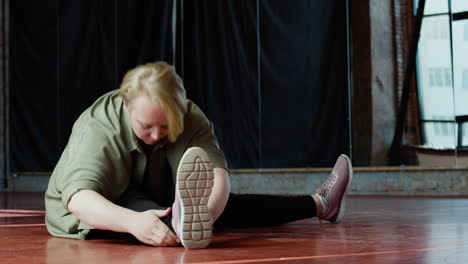 woman stretching indoors