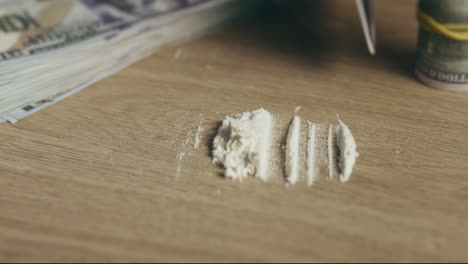 cocaine, table and lines of drugs with hand