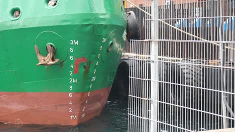 ship at a dock with depth markings