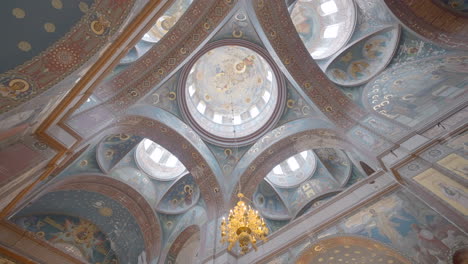 orthodox church interior with detailed ceiling paintings