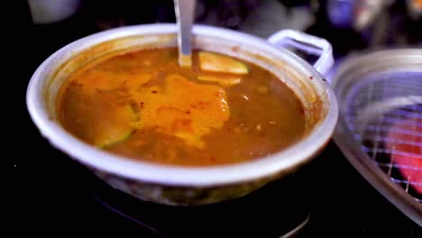 soybean paste stew cooking in a pot