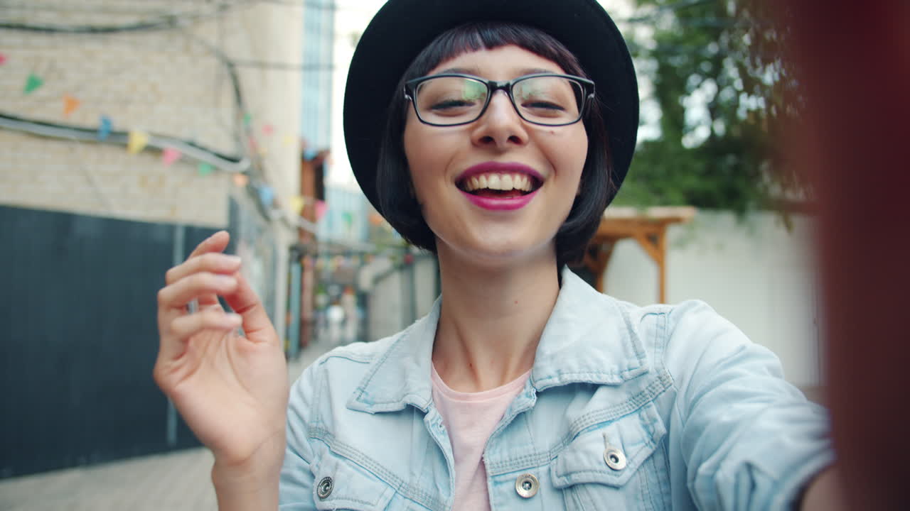 Happy Woman Taking a Selfie in an Urban Setting