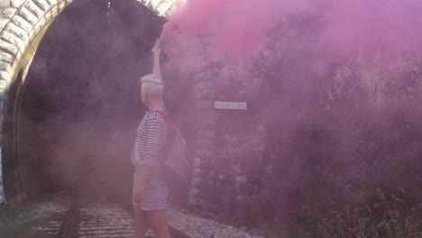 pink smoke in a tunnel