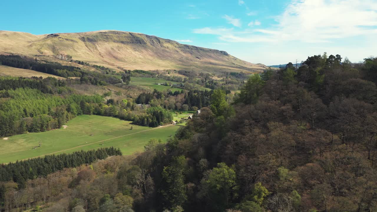 Scenic Mountain Valley Landscape with Forests and Fields