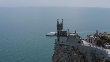 a castle on a cliff overlooking the sea