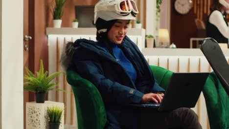 asian woman working on laptop