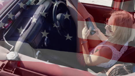 animation of flag of usa over happy diverse women in car by beach in summer