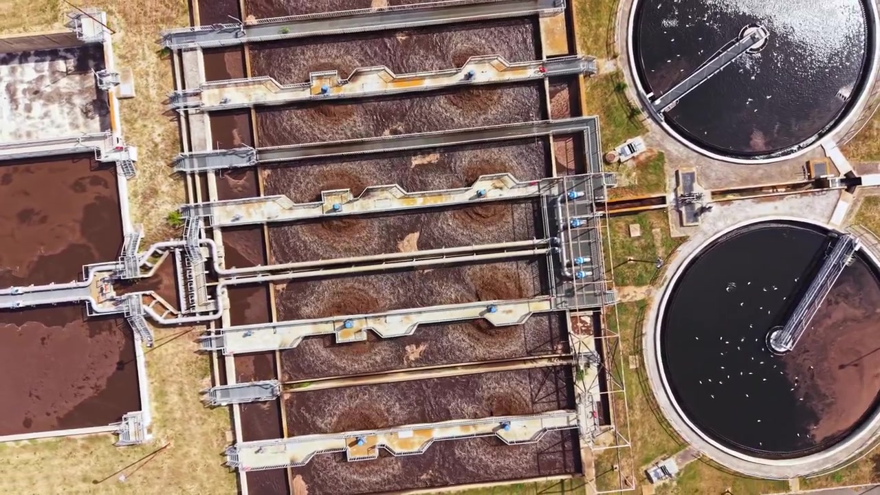 Water treatment facility processes wastewater in a large urban area during daylight