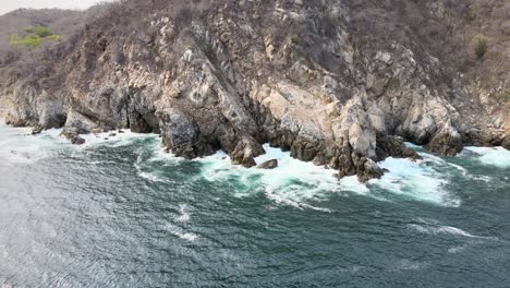 pull back with view of cliff in oaxaca's shore