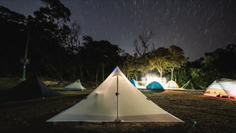 night lapse of starry sky over busy campsite, cheung sheung sai kung hong kong