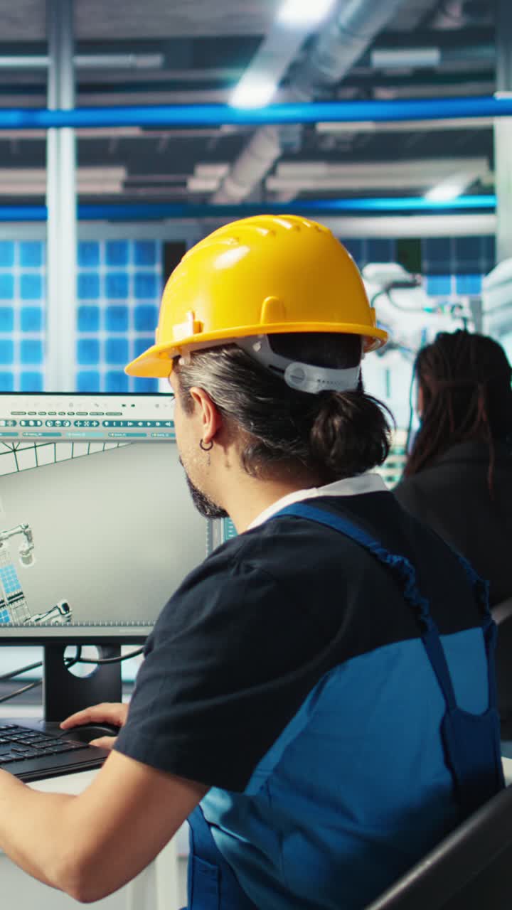 Vertical Video Photovoltaics Factory Engineer Using Pc To Test Robot Arms Solar Panels