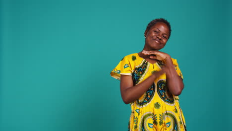 Charming-pretty-woman-waving-her-hand-to-say-hello-in-studio