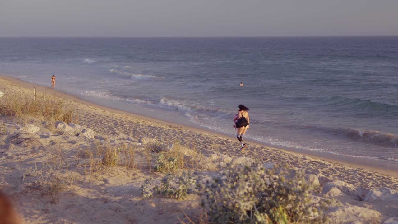 Woman with Prosthetic Leg at the Beach