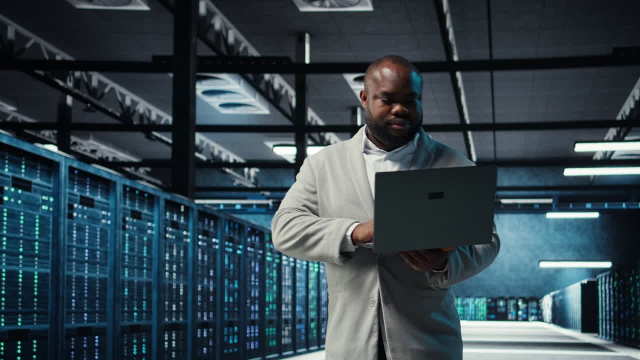 Vertical video Engineer walking in data center using AI automation during maintenance session
