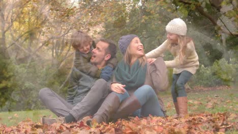 Animation-Einer-Glücklichen-Kaukasischen-Familie,-Die-Im-Park-Vor-Abstraktem-Hintergrund-Spielt-Und-Genießt