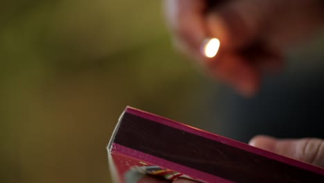 lighting up wooden matchsticks closely for smoking