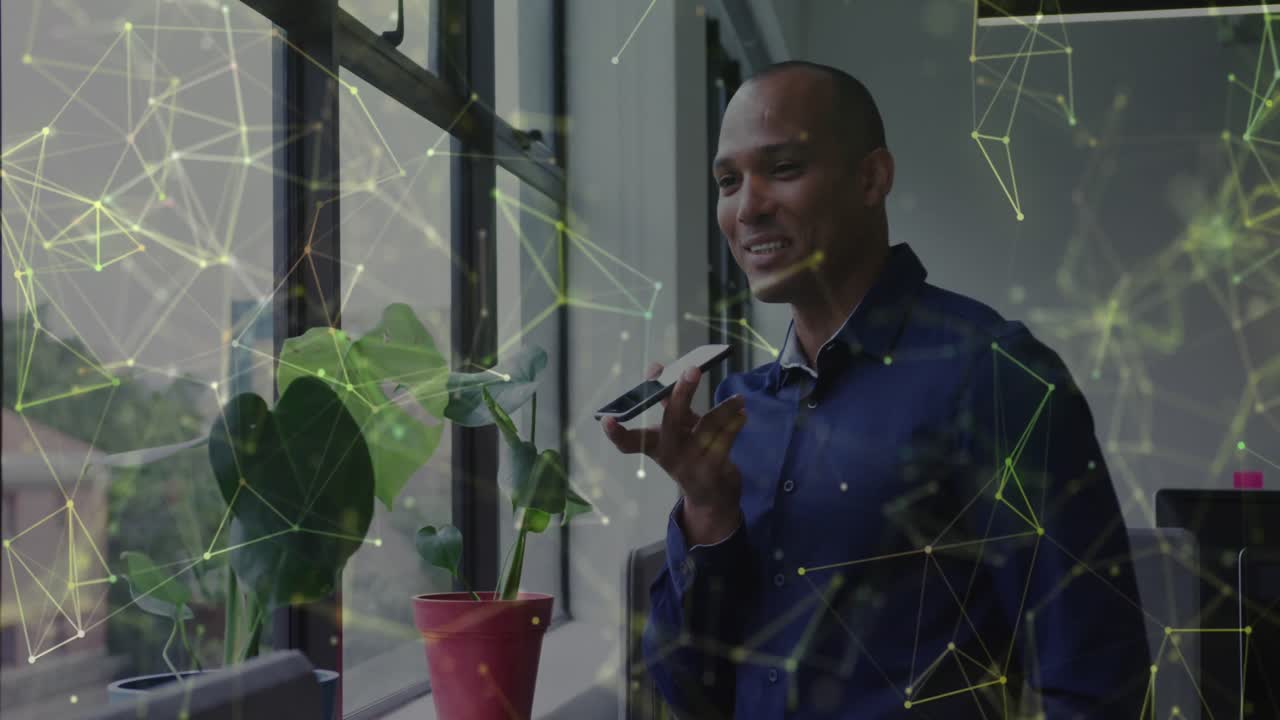 Animation of connections and data processing over biracial businessman using phone in office