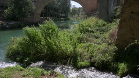 view of a river as the trillo nuclear power plant is seen in the background in the guadalajara province in spain