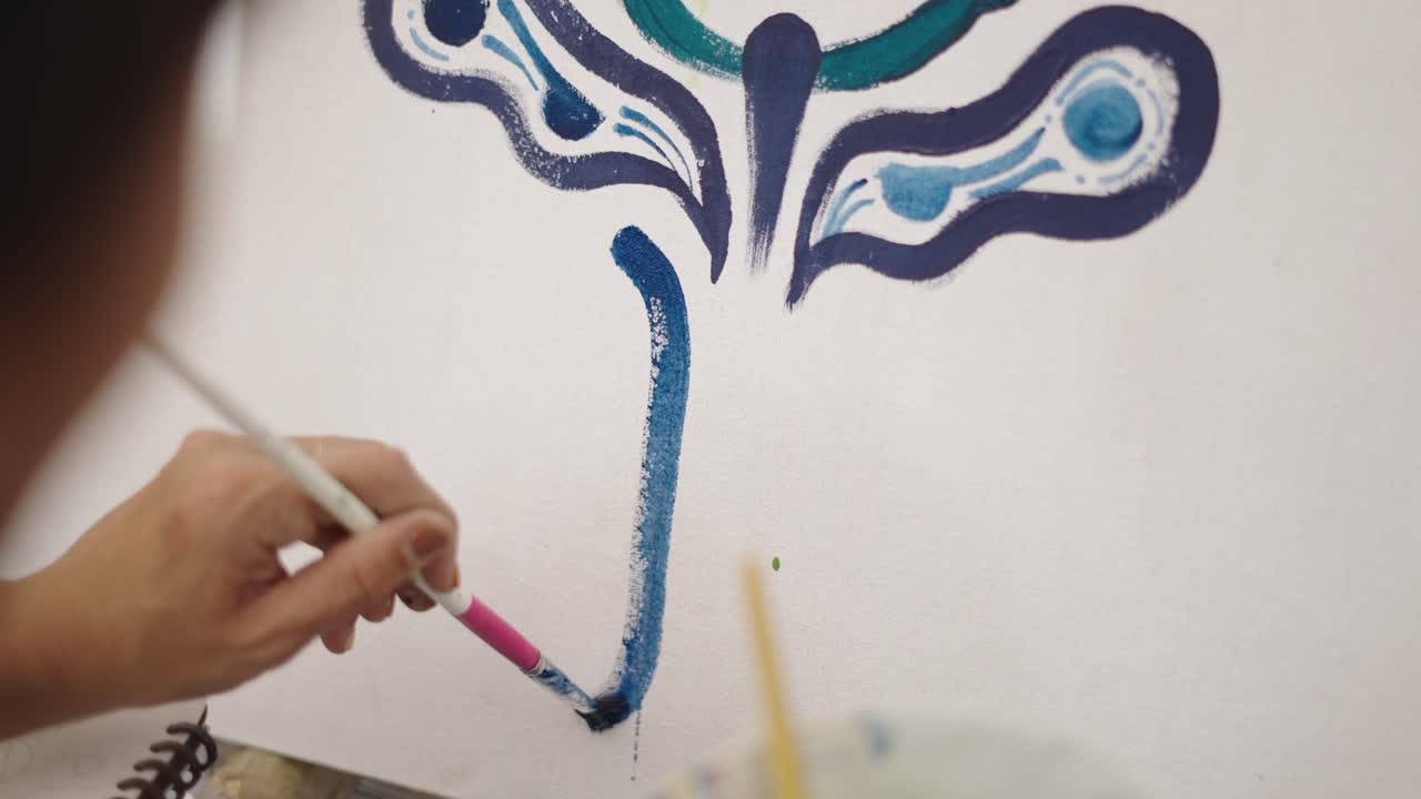 Artist Painting Abstract Design on Canvas