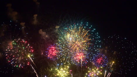 beautiful abstract colourful fireworks explode display on sky at night a symbol of celebration in new years anniversary for background