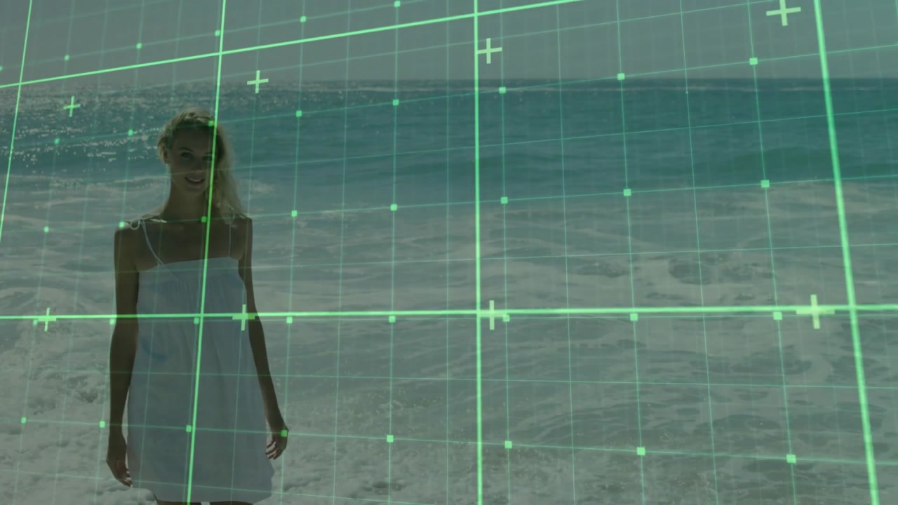 Female walker entering frame walking shore toward camera showing green grid tracking technology