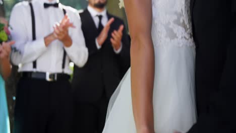 Groom-and-bride-standing-in-smiling,-holding-hands-in-wedding-day-4K-4k