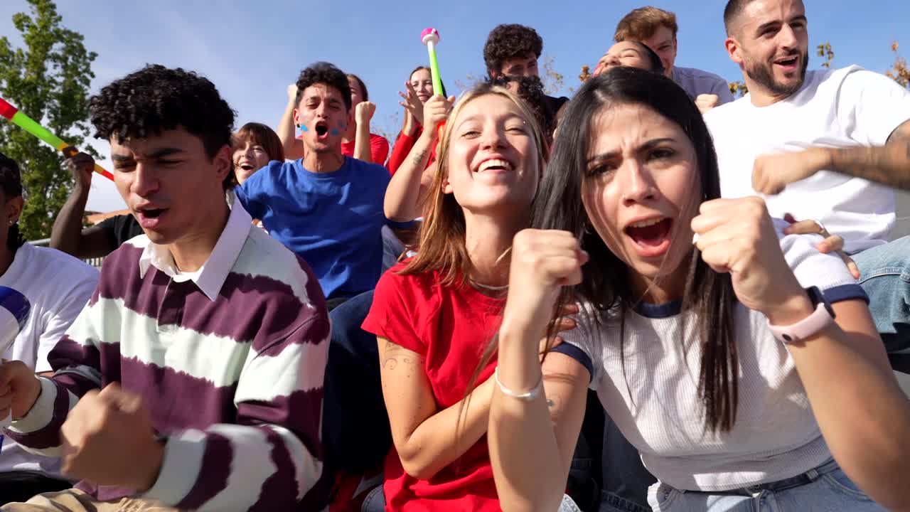 Excited Fans Cheering at a Sporting Event