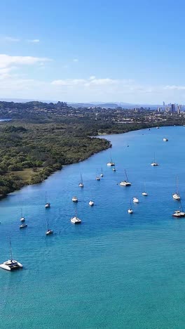 boats on tweed river under clear blue skies