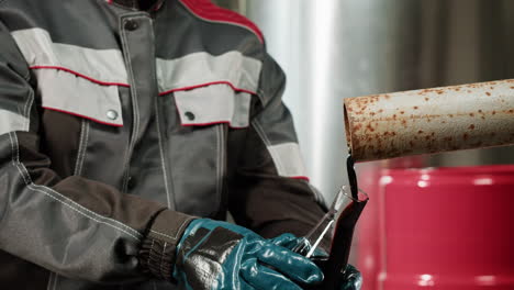 industrial worker handling oil product