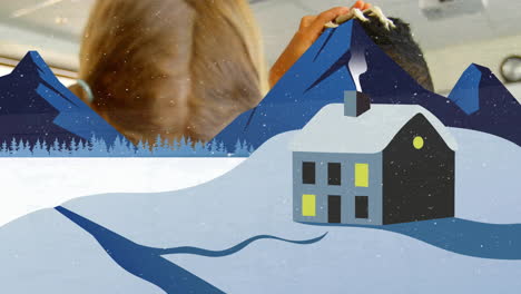 Snowy cabin animation over child playing with toy in background