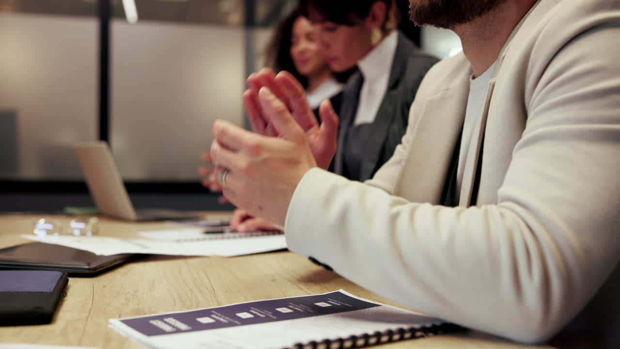 Business Team Applauding in a Meeting