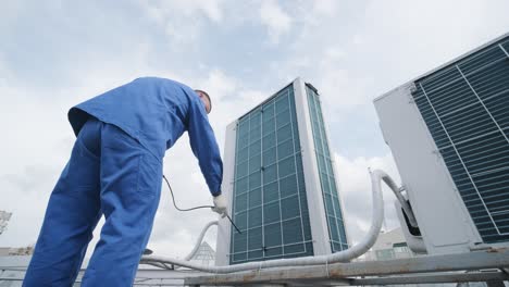 the technician uses a digital camera to check the clogging of the heat exchanger