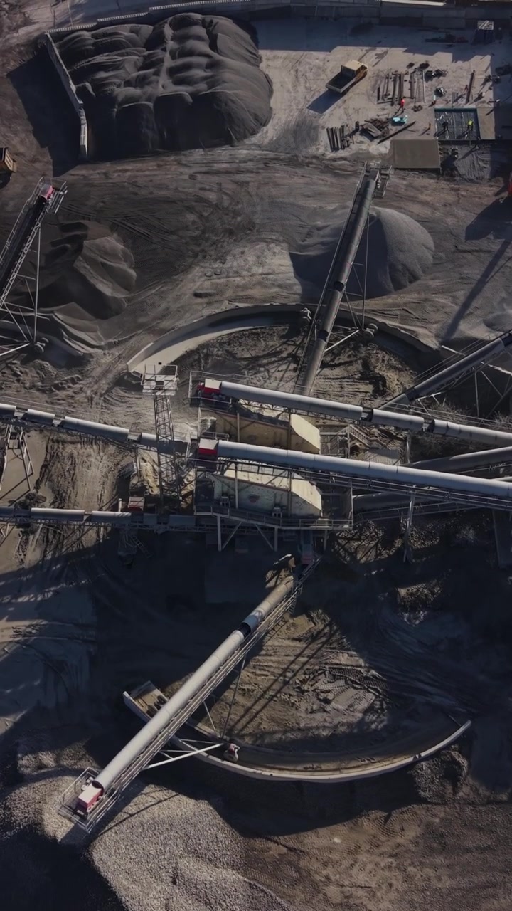 Quarry site showing machinery and trucks for mining operations