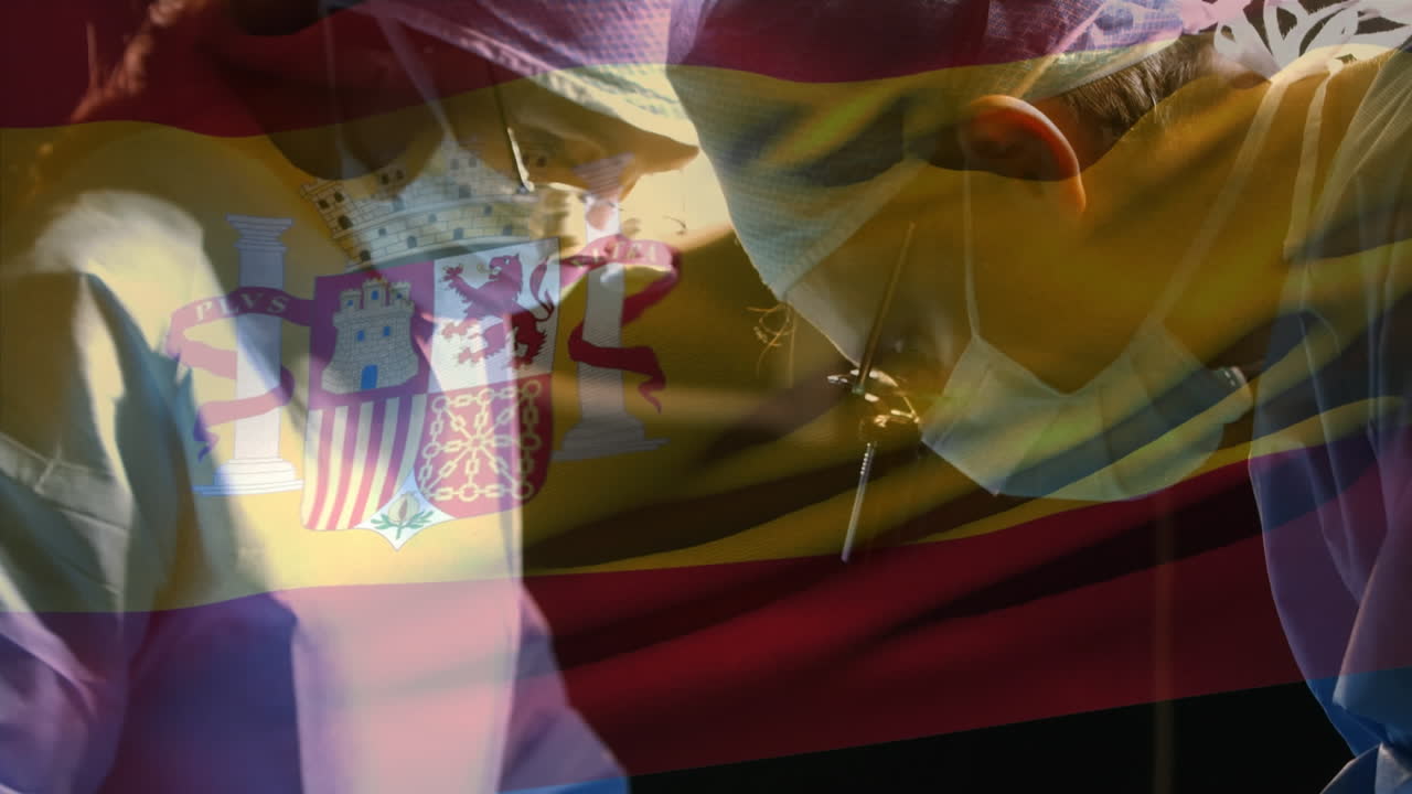 animación de la bandera de españa ondeando sobre los cirujanos en el quirófano