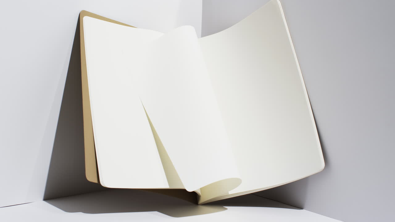 Video of book with white blank pages and copy space on white background