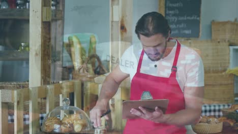 Animation-of-financial-graphs-over-caucasian-male-seller-in-bakery